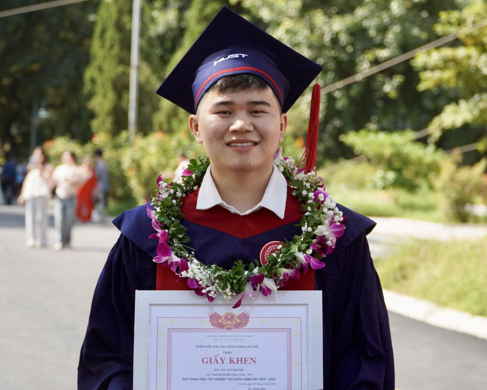 Lê Cảnh Hải in graduation robes at Hanoi University of Science and Technology